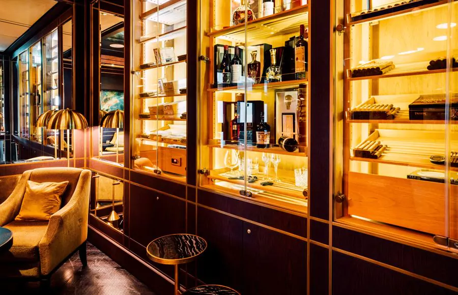 Sophisticated cigar lounge with premium humidor and comfortable leather seating